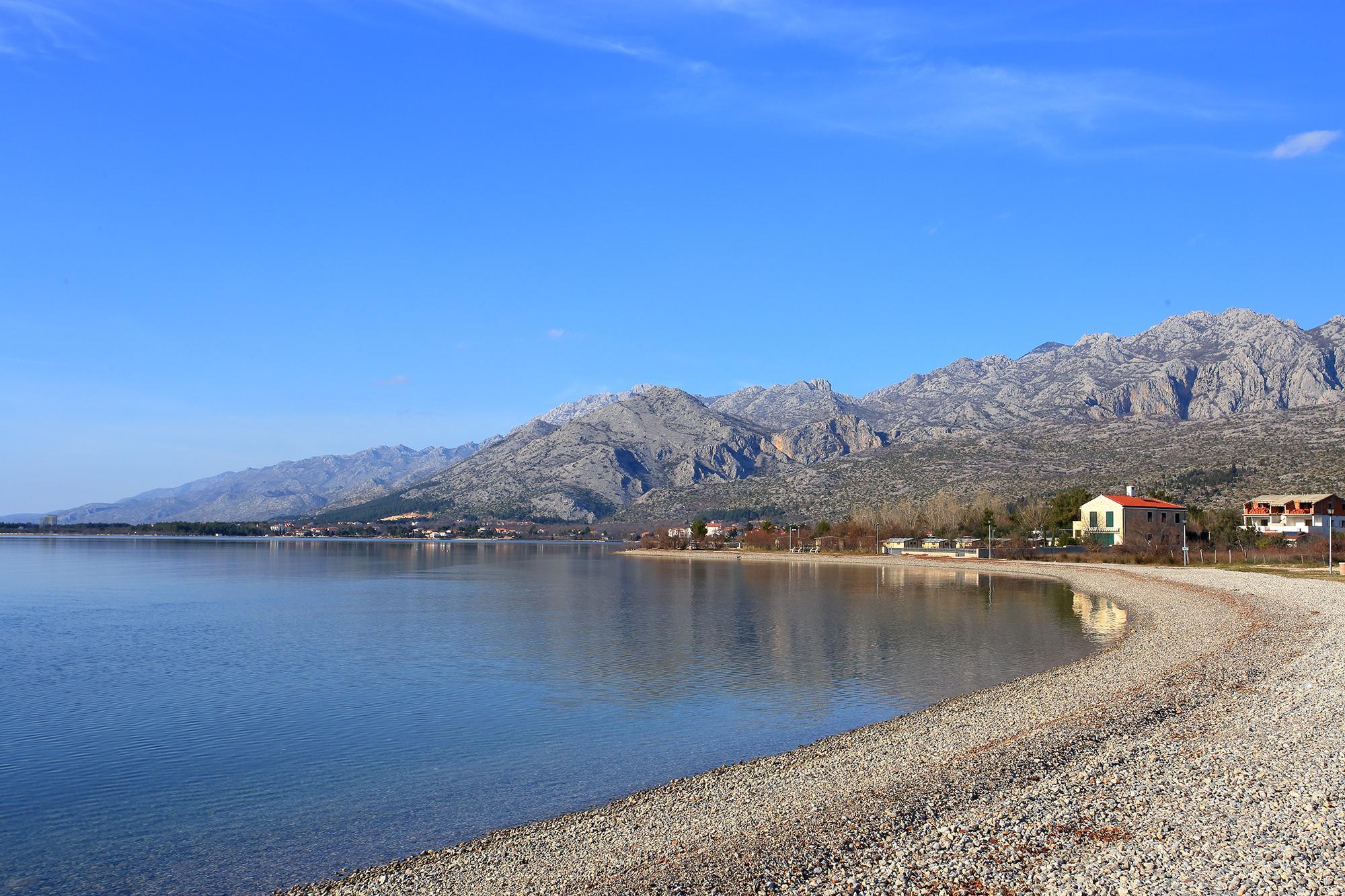 This photo about Memory lane - where the mountain hugs the sea shared on HyHotel.com