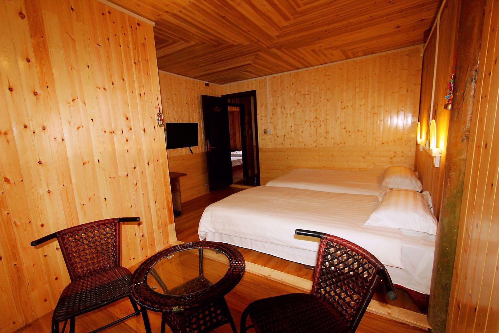 This photo about Floor-to-ceiling window twin roomPure wooden stilt shared on HyHotel.com